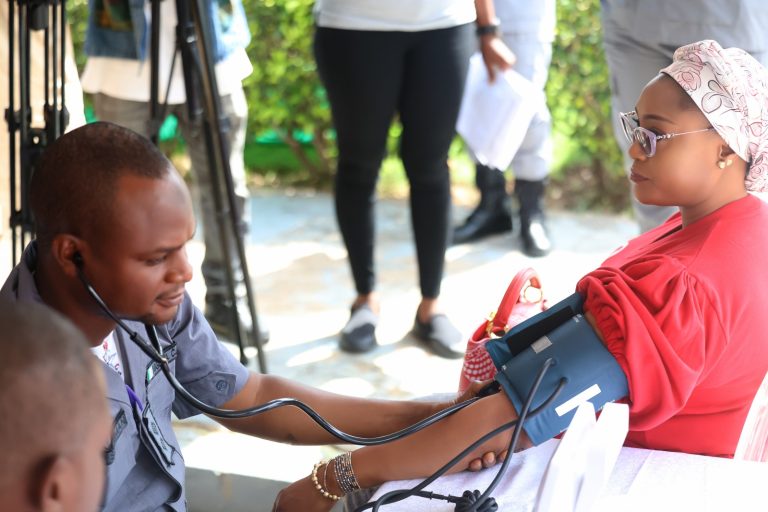 PRESIDENT, CUSTOMS OFFICERS’ WIVES ASSOCIATION DISTRIBUTES BP MONITORS TO FAMILIES